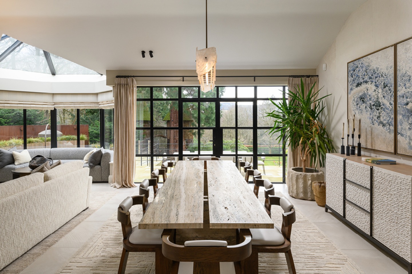 Grand Scale dining room with expansive bay windows framing views to the south and over the landscaped gardens