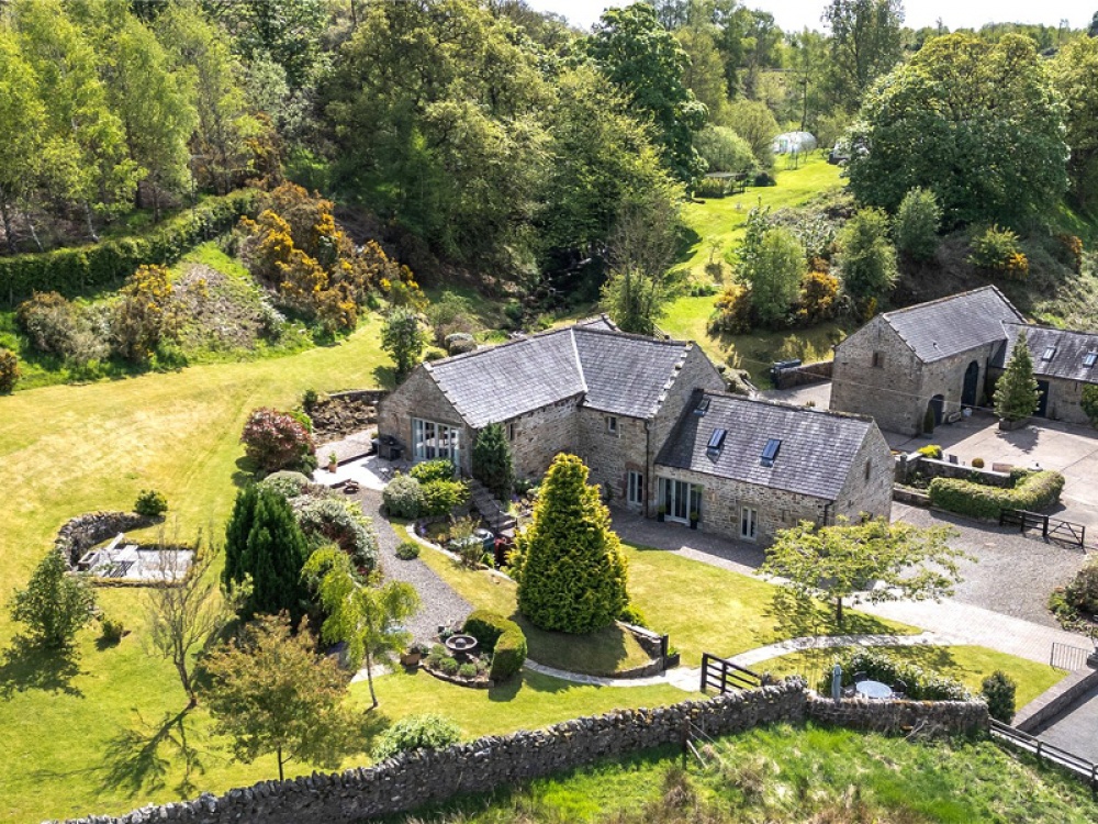 Take a Tour of this Stunning Converted Mill with its Own Waterfall