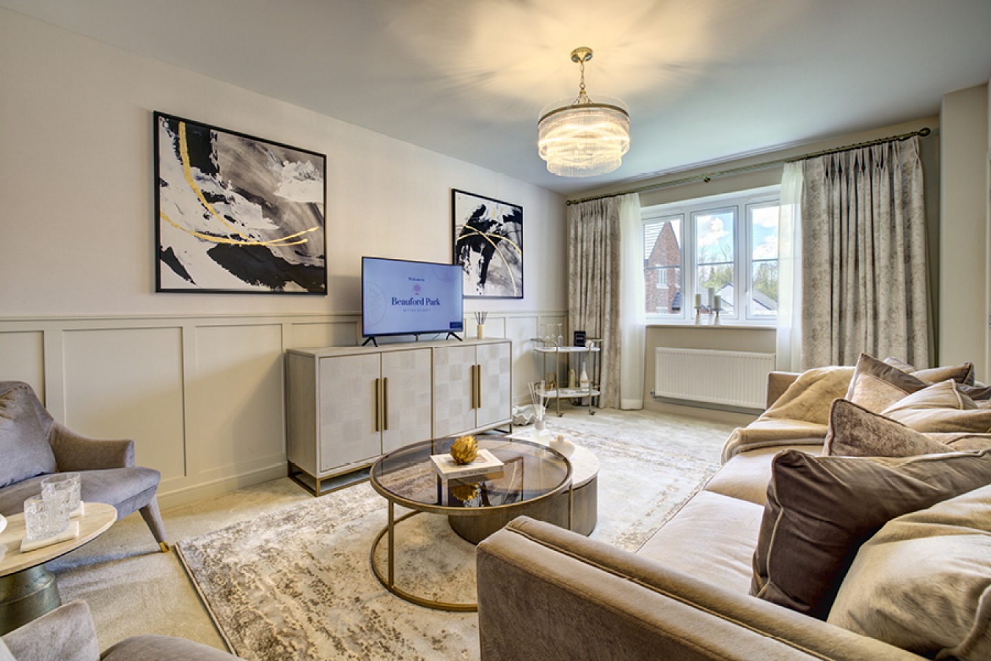 Modern lounge with neutral colours and abstract artwork