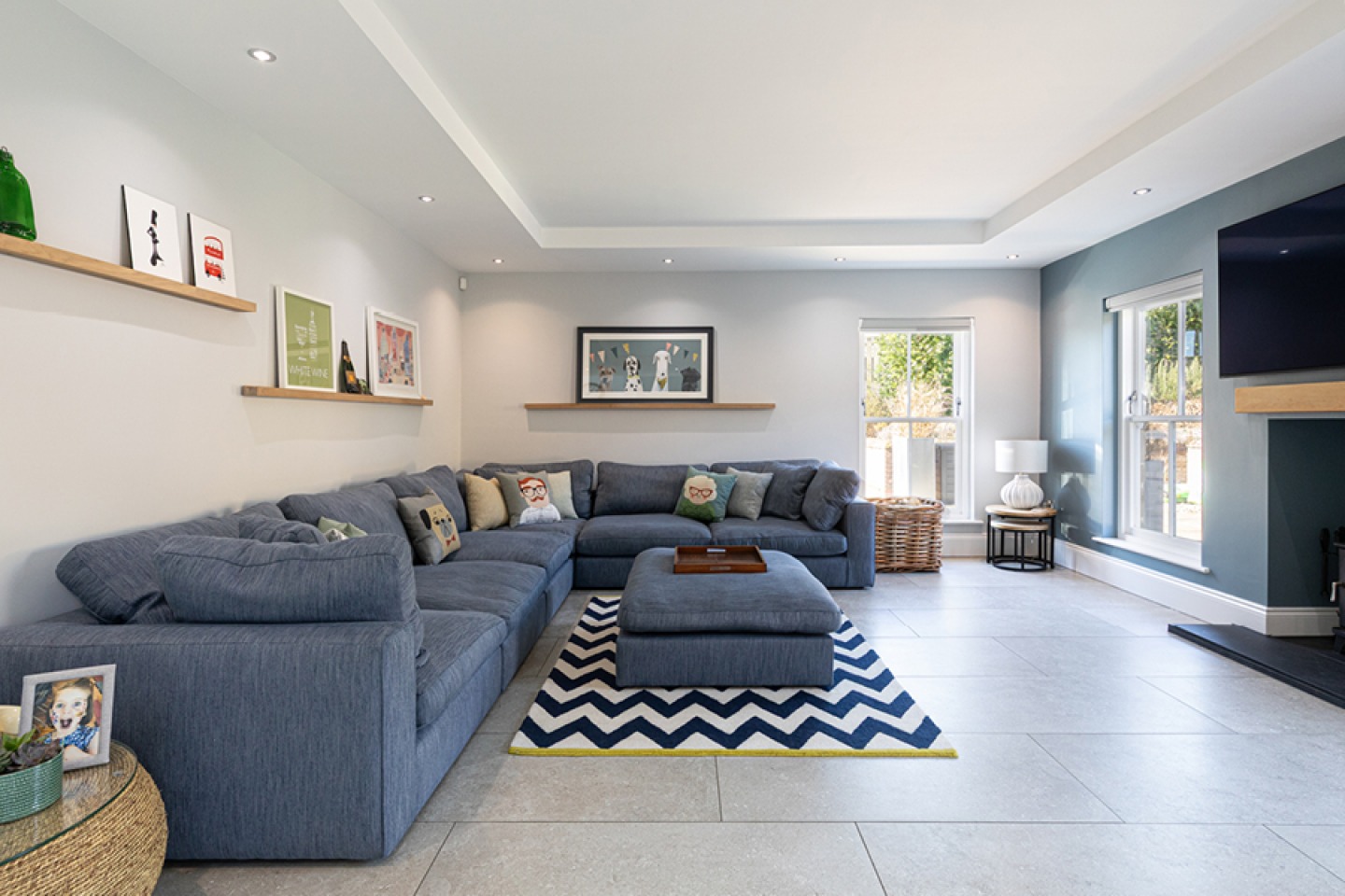 Modern lounge with large windows and open fireplace