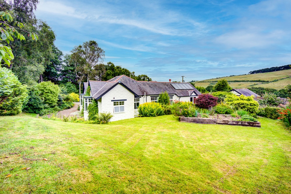 Large bungalow with lush gardens
