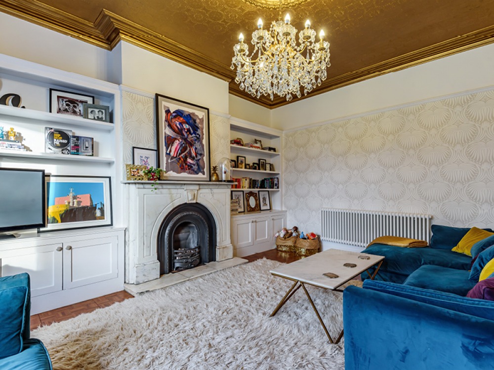 blue sofa and open fire