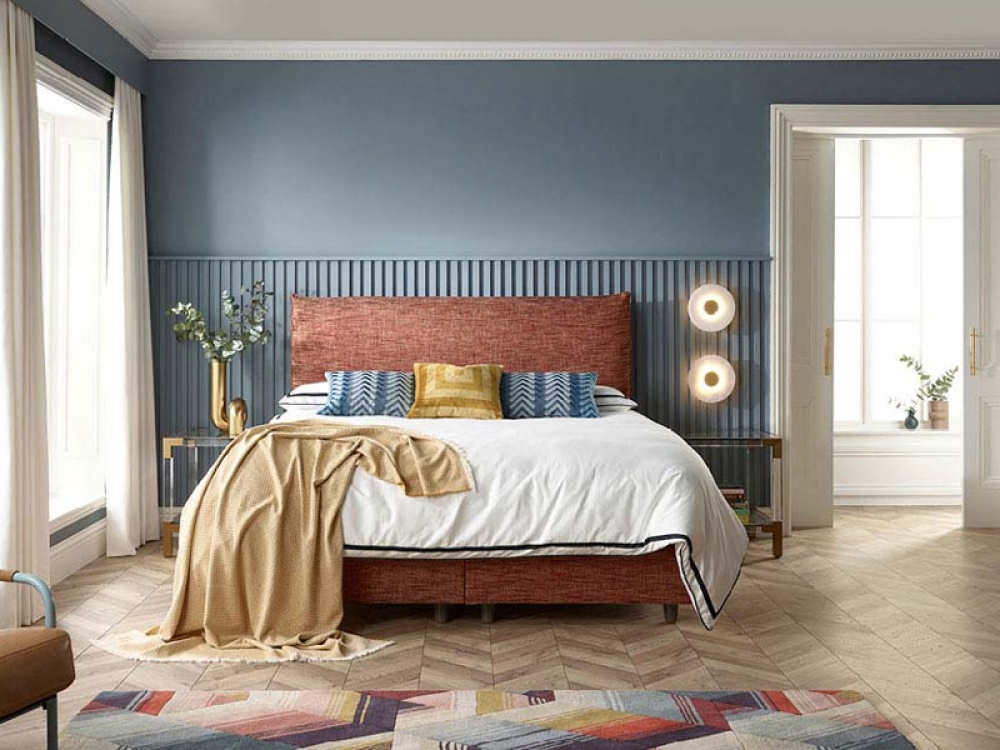 brown fabric double bed in a navy room