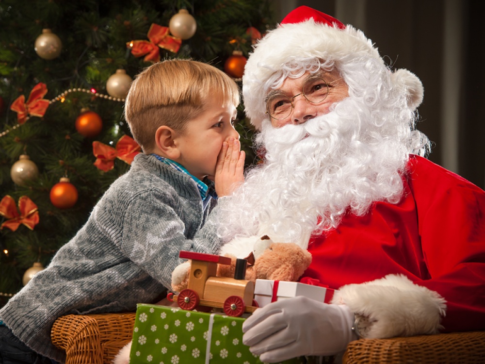 Santa listening to a little boy