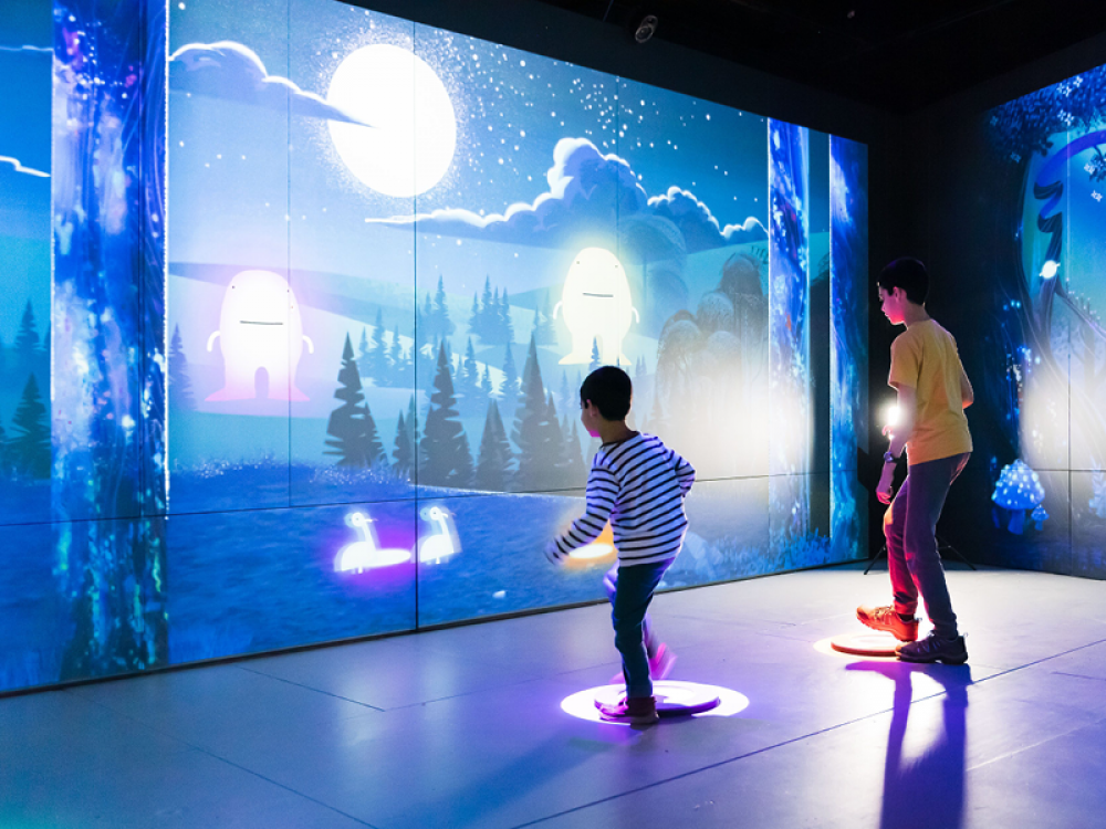 Science museum dark room with purple lights