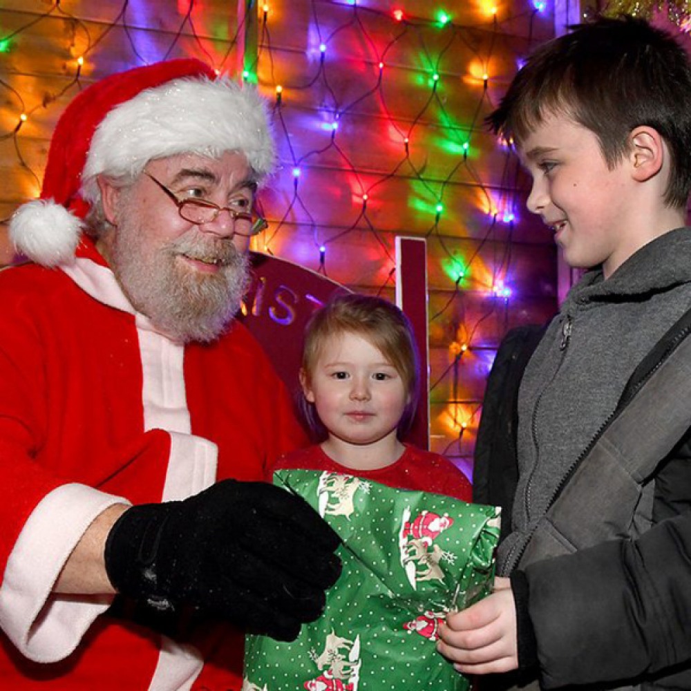 Santa giving gifts to children