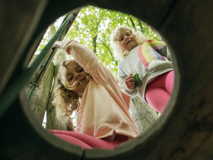 Two young girls playing at Sutton Bank National Park Centre