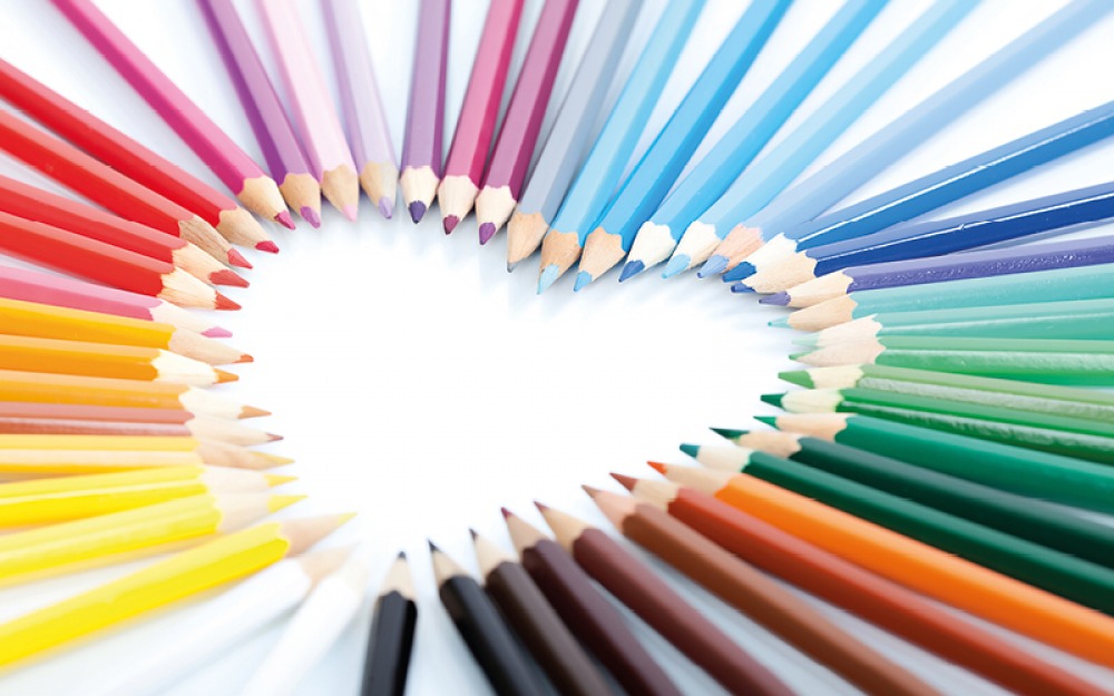 coloured pencils pointing to a heart shape