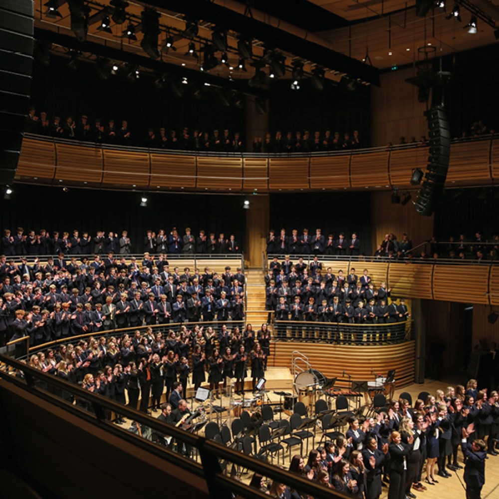 Chior singing in a music hall
