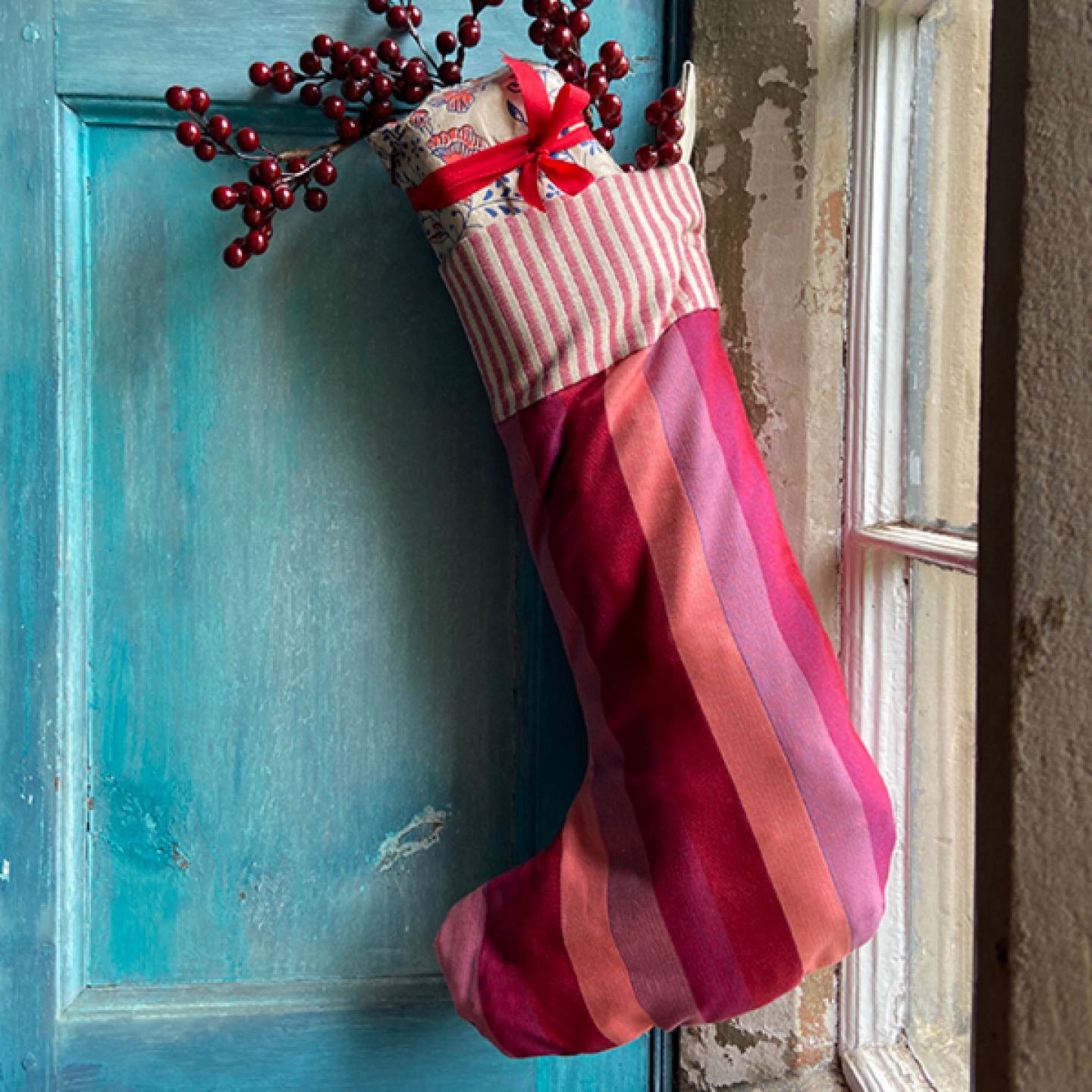 red stocking hanging on window