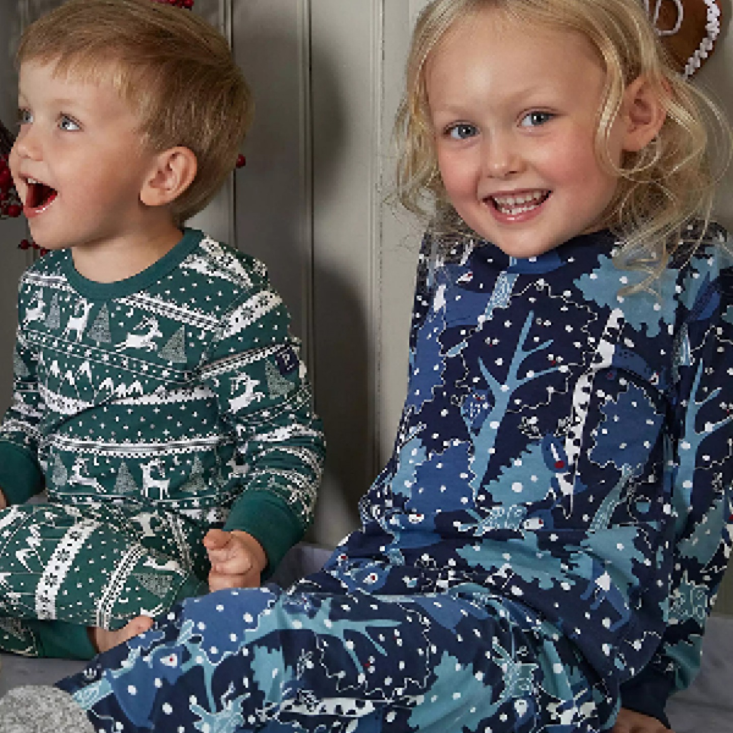 2 young kids in Christmas pj sets