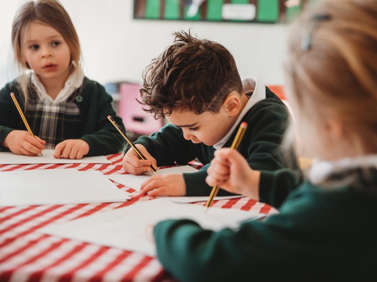 Children at school writing