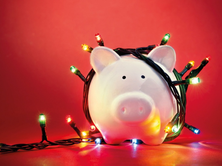Christmas lights wrapped around a piggy bank