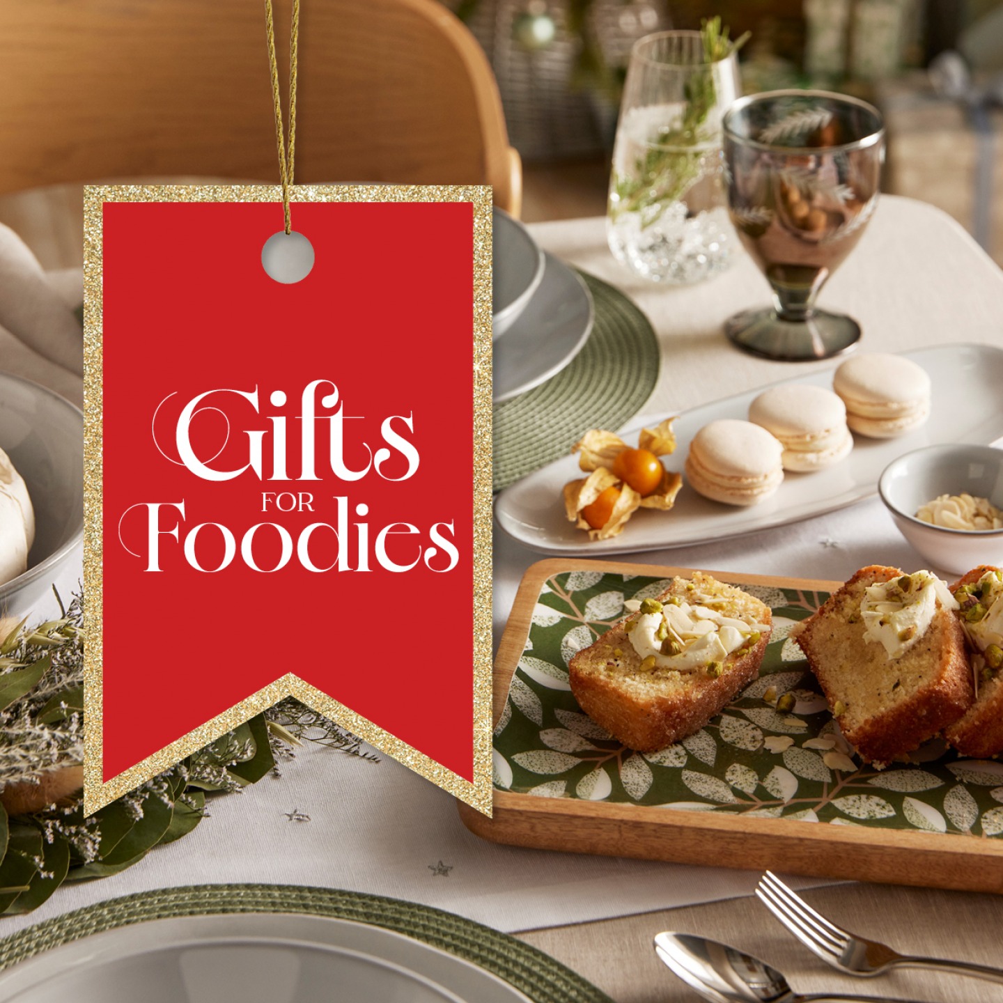 Table set with white and green tableware, loaf cafe and macaroons