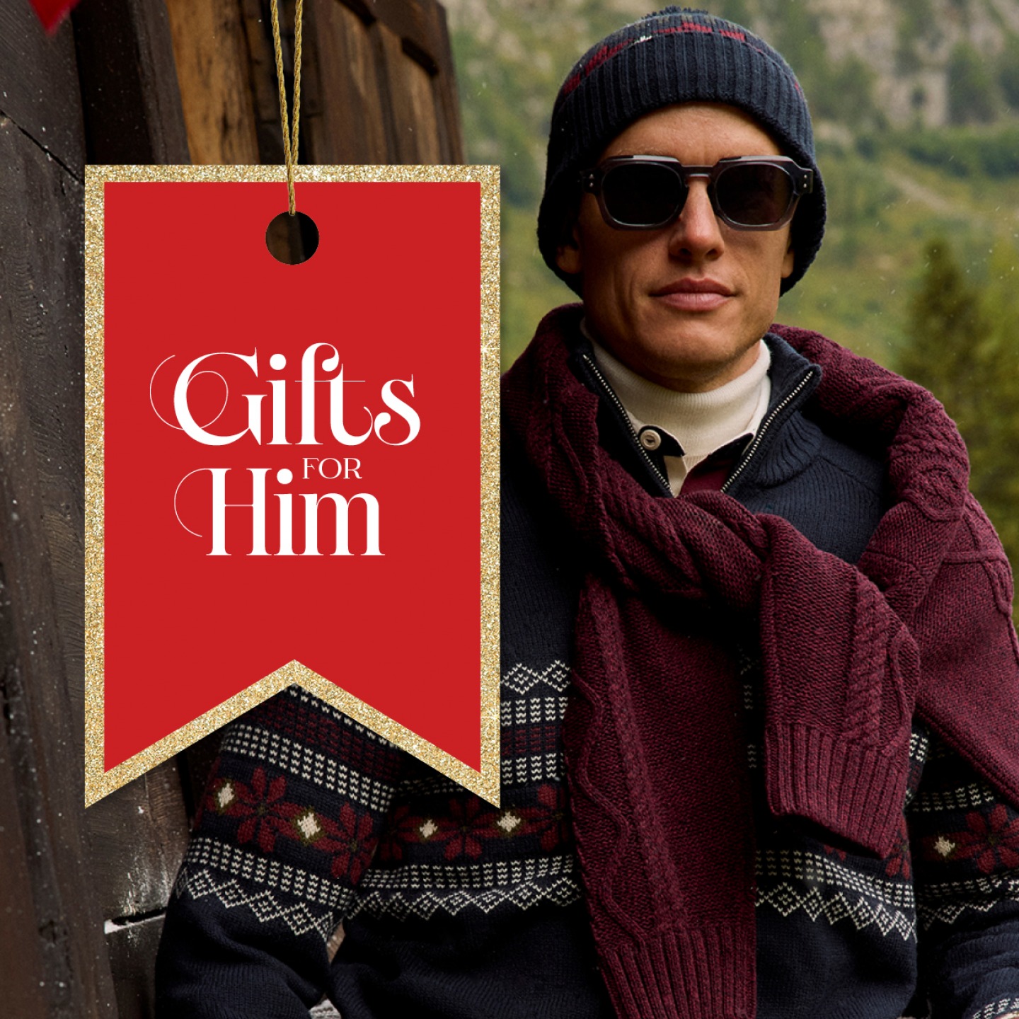 Man wearing knitted jumper around his shoulder and wooly hat with sunglasses