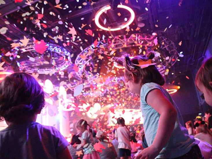 dark room with confetti falling