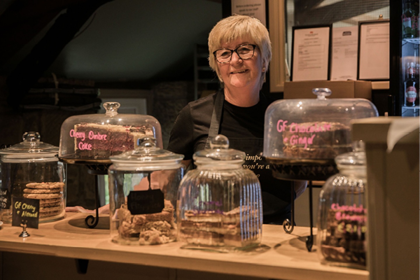 woman behind a food counter