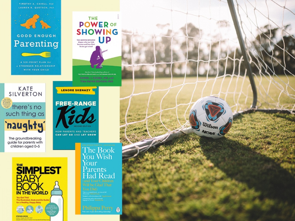 Football sitting in a goal and 6 parenting help books.