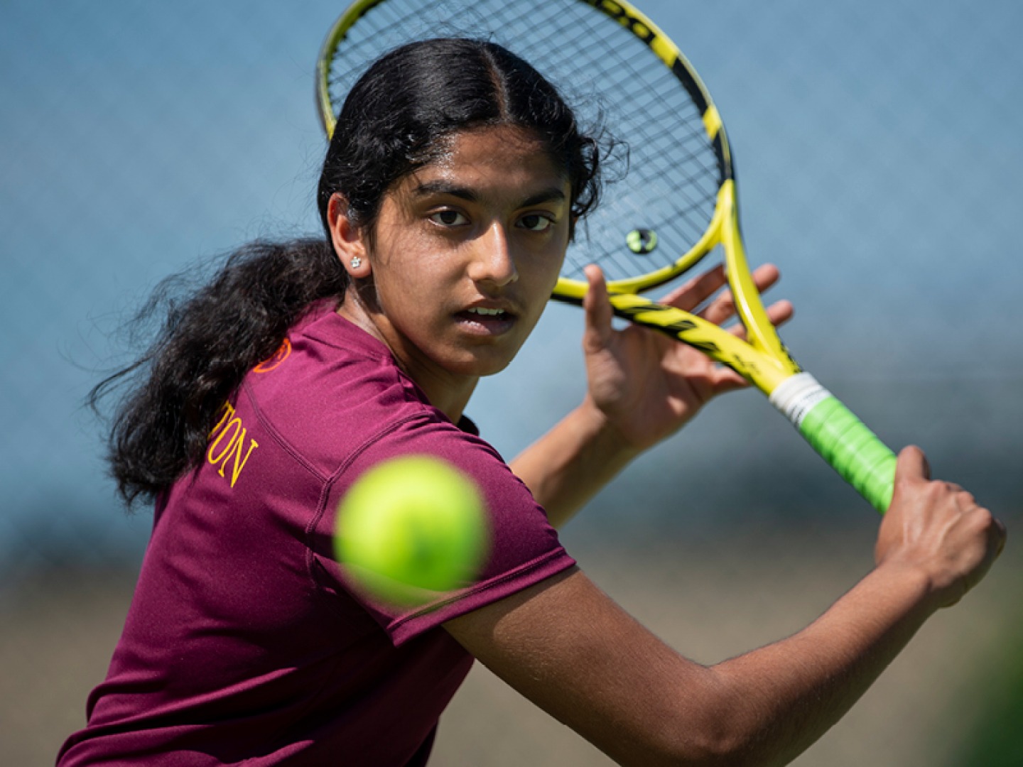 Close up of a Repton student playing tennis