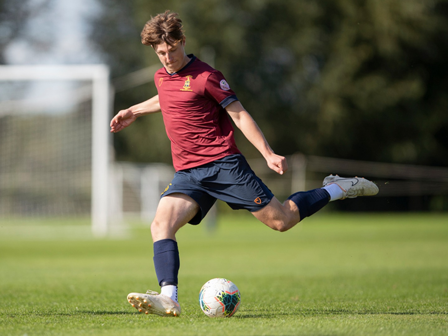 Action shot of a Repton student playing football