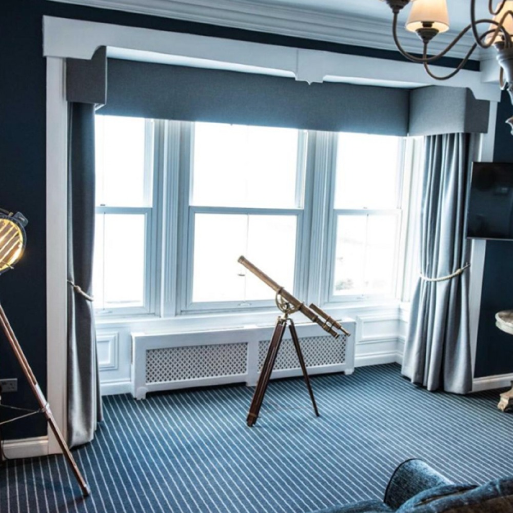 telescope looking out a bay window