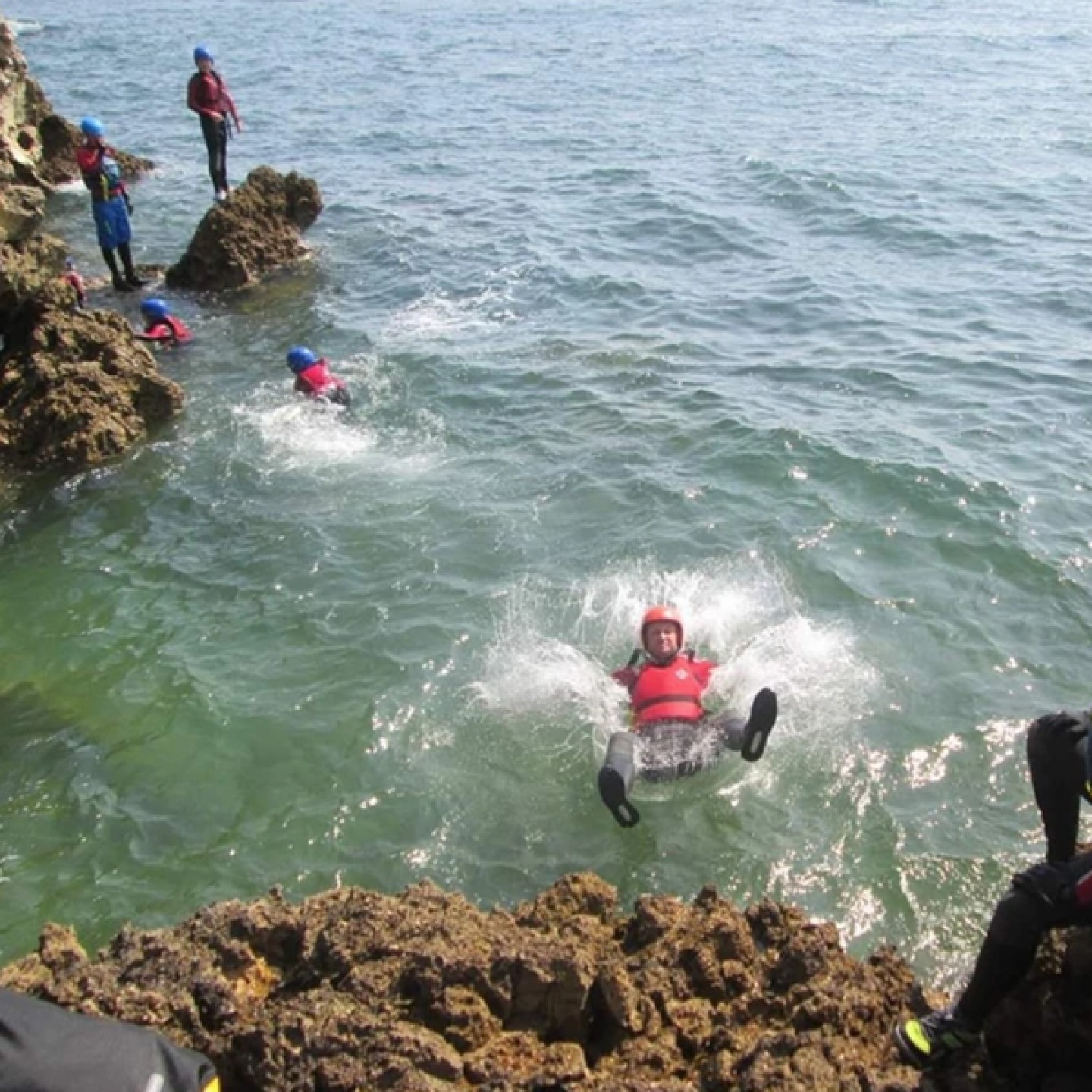 people coasteering
