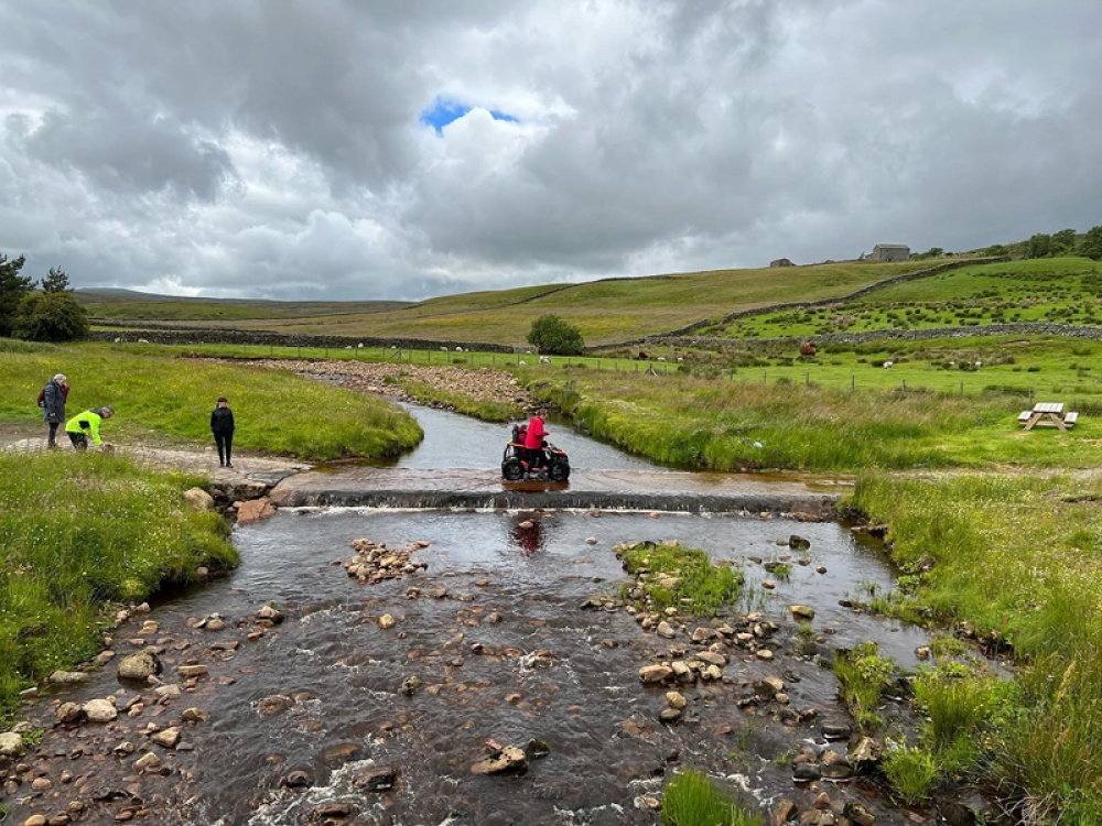wheelchair crossing a river in the Yorkshire Dales