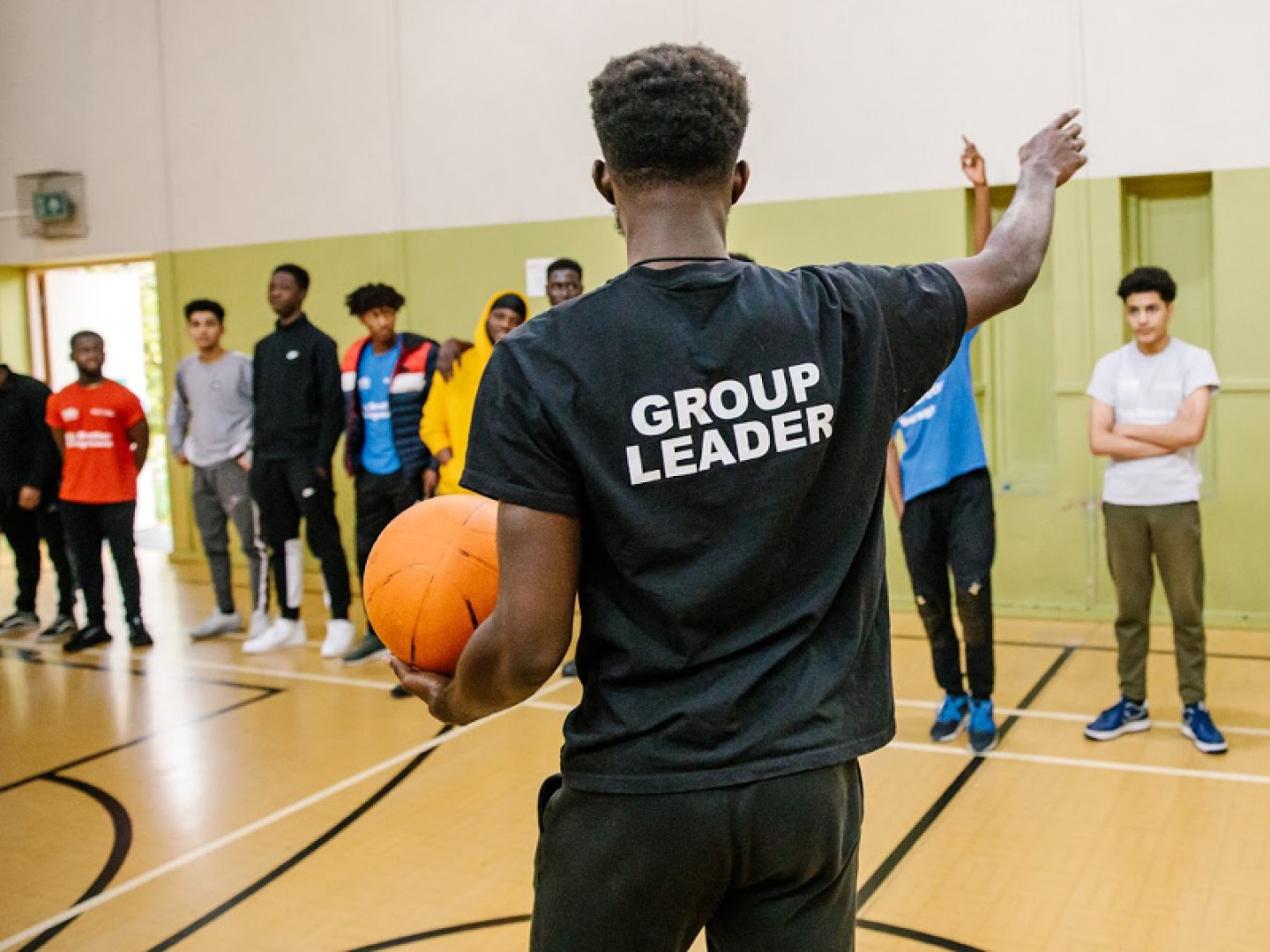 Man coaching basketball