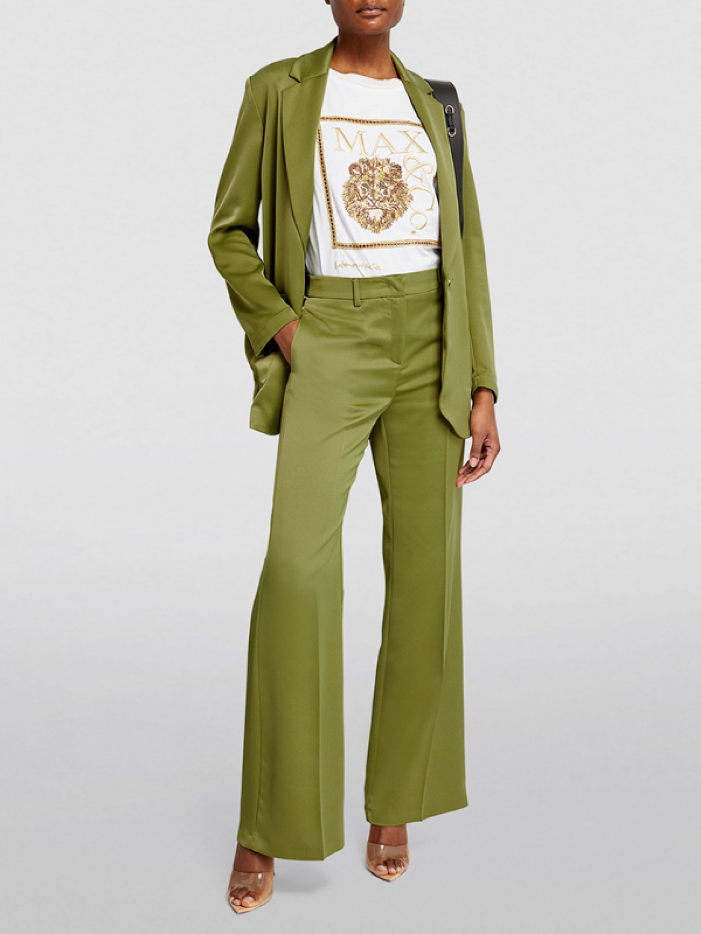 model wering Satin trouser suit with white and gold T-shirt