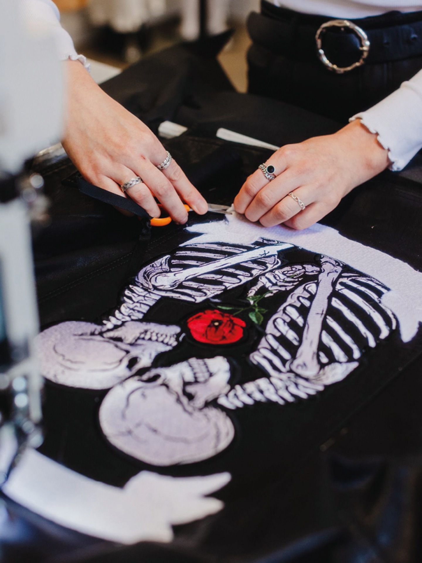 Black Leather jacket with embroidery of two Skeletons facing each other with a rose between them