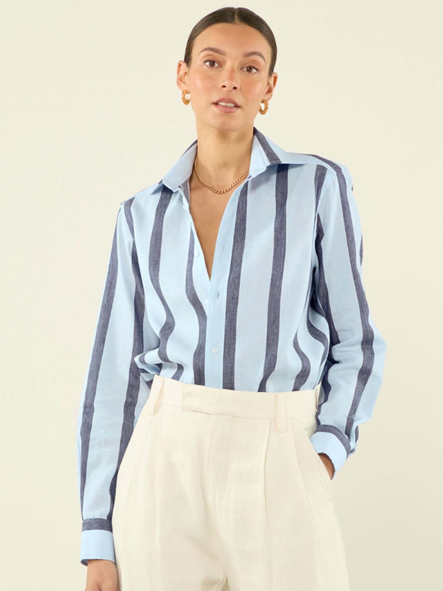 model wearing light and dark blue weave shirt