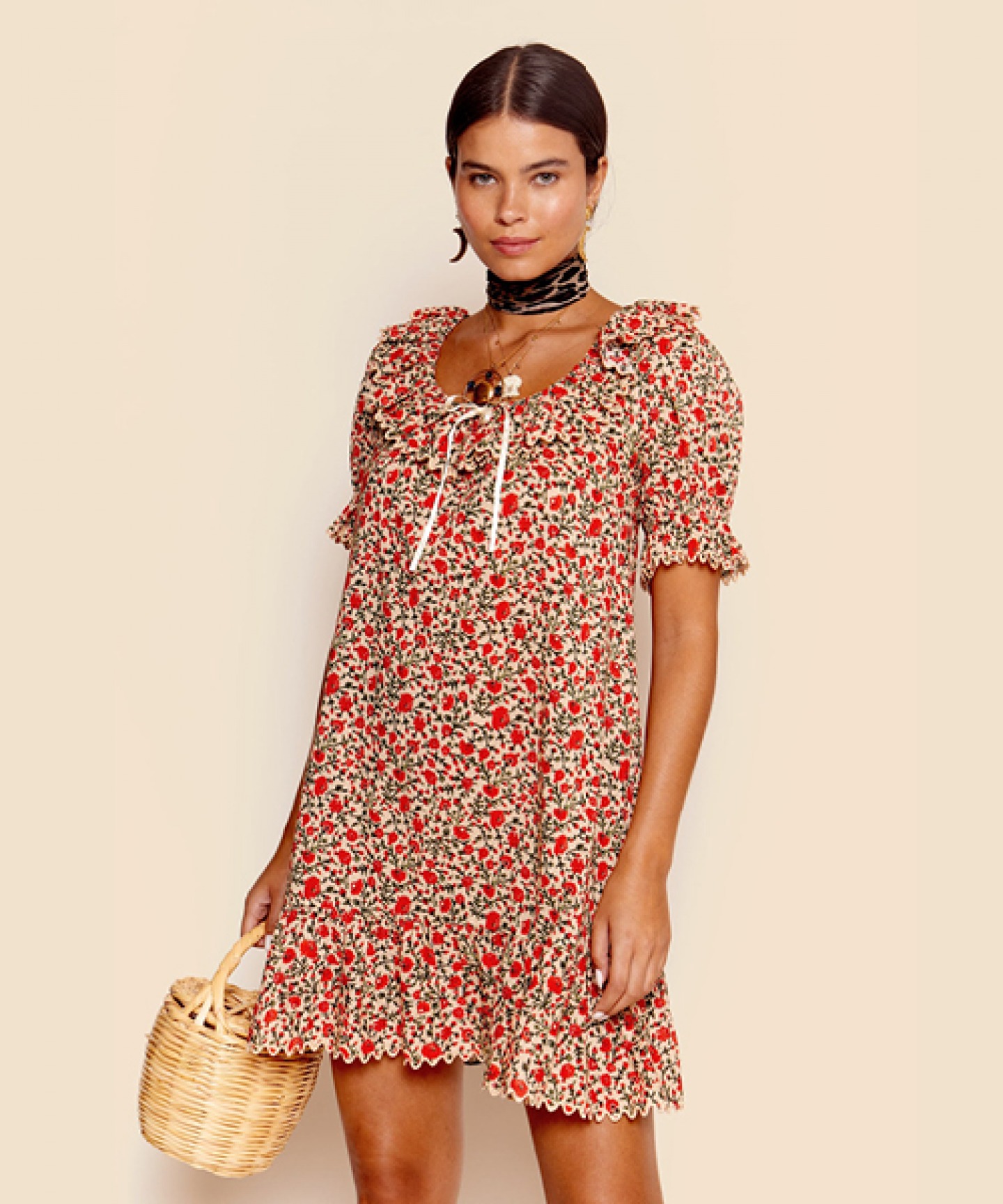 Model wearing a floral ditsy dress from Rixo