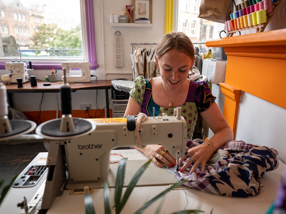 Sarah Sewing in her store