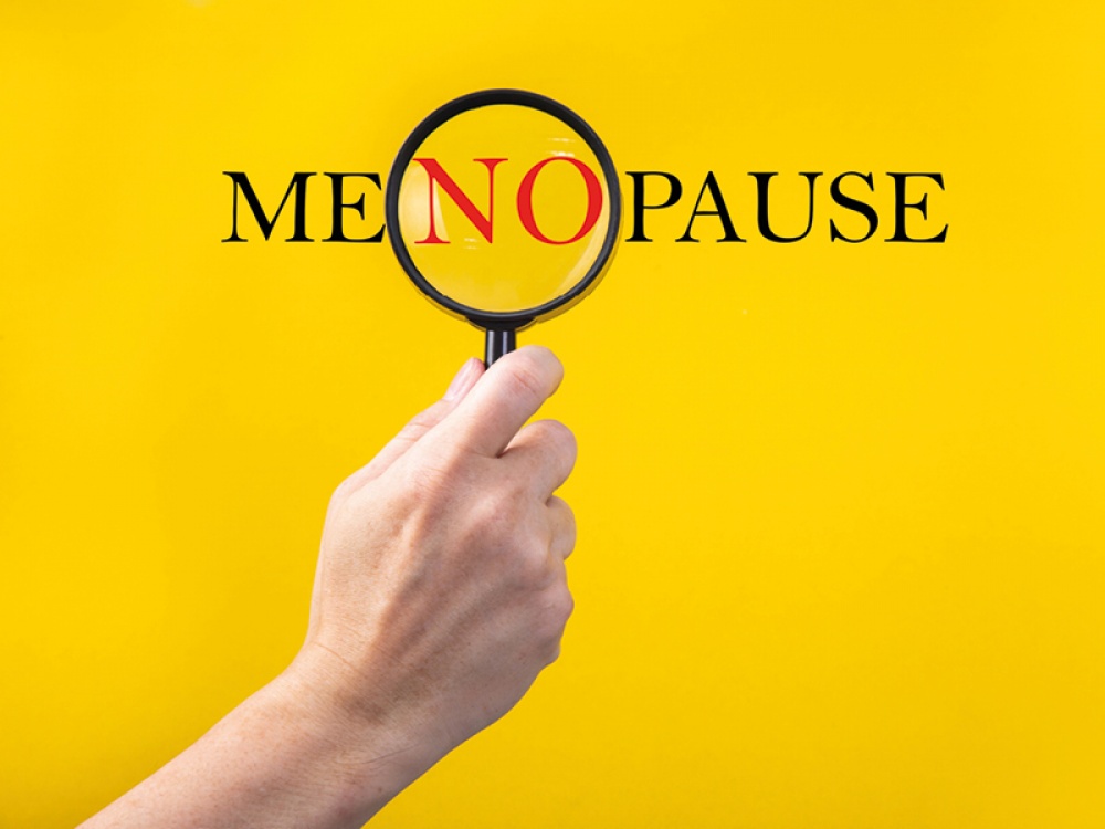 word MENOPAUSE on a yellow background