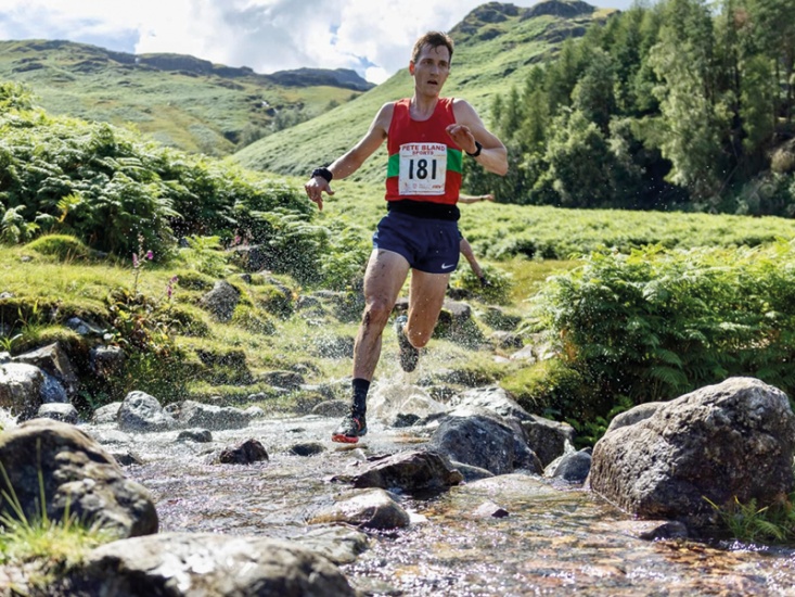 Ben Rothery English Fell Running Champion From Yorkshire running through a stream