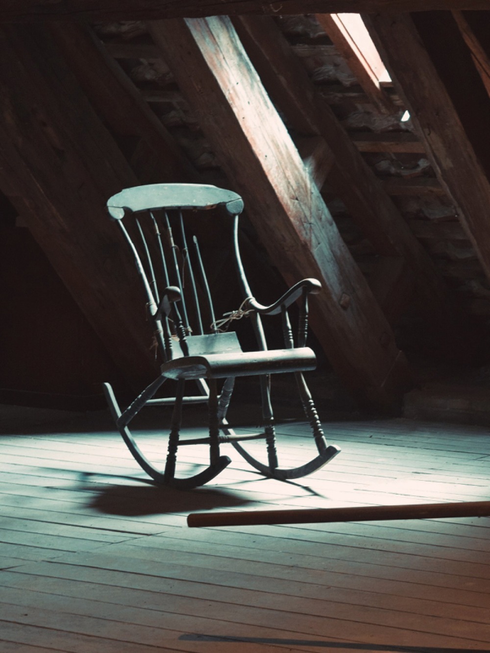 Rocking chair in a dark attic