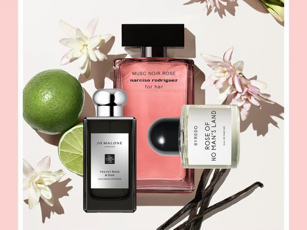 3 perfumes bottles features with flowers limes and vanilla pods