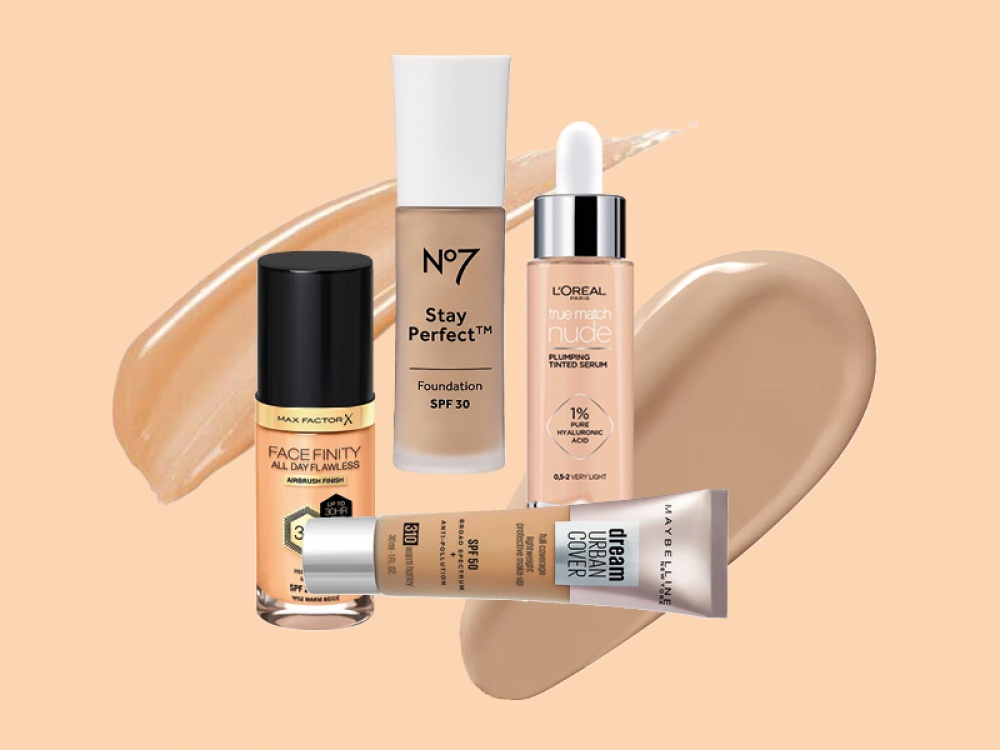 foundation bottles on a peach background