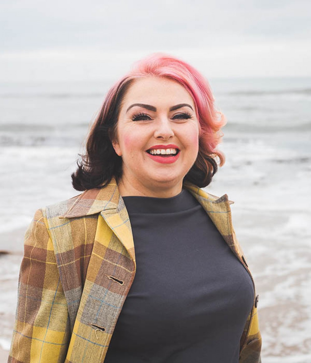 woman posing at the shore