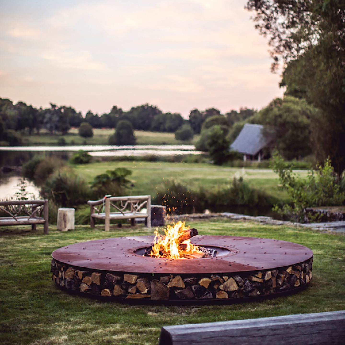 Large stone fire-it overlooking a lake