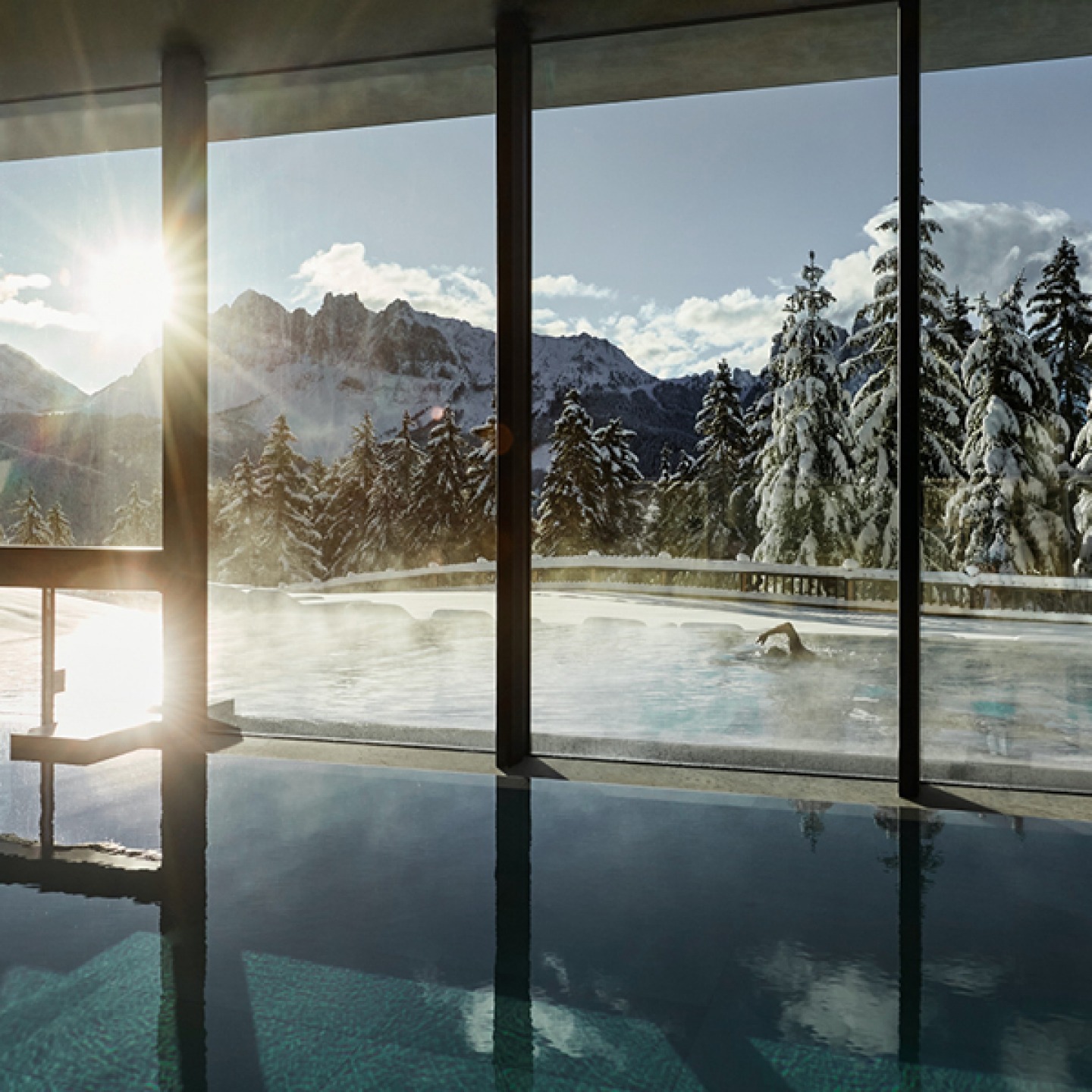 indoor/outdoor spa pool looking over Dolomites