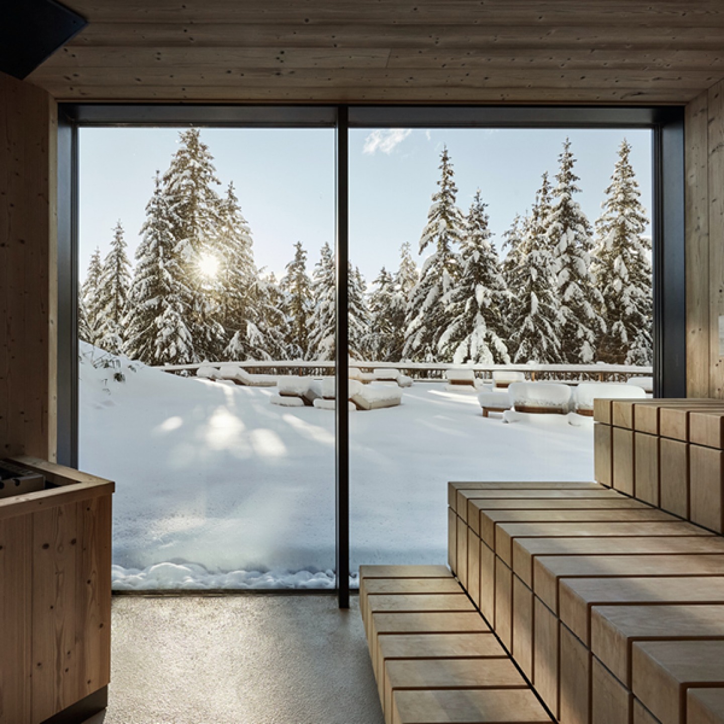Sauna looking out onto snow-covered patio
