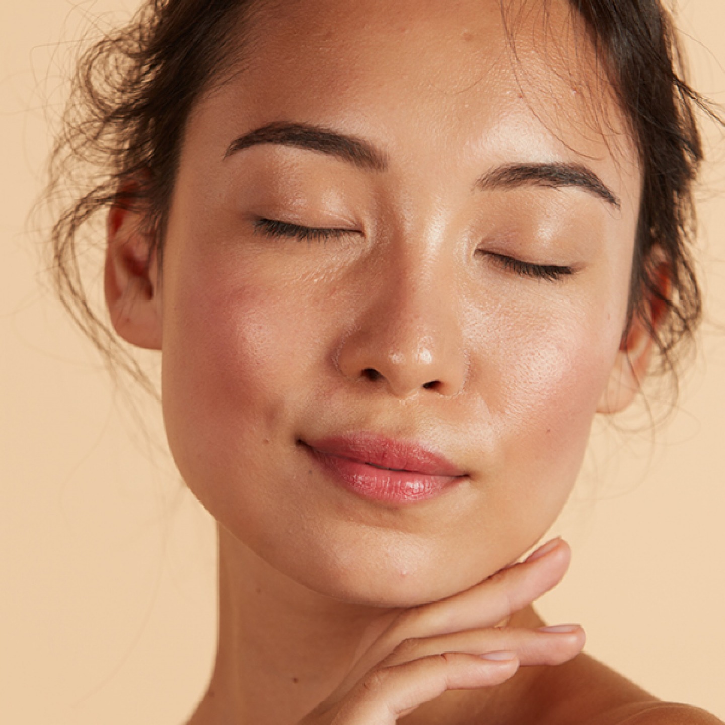 Model with eyes clothes and glowing skin