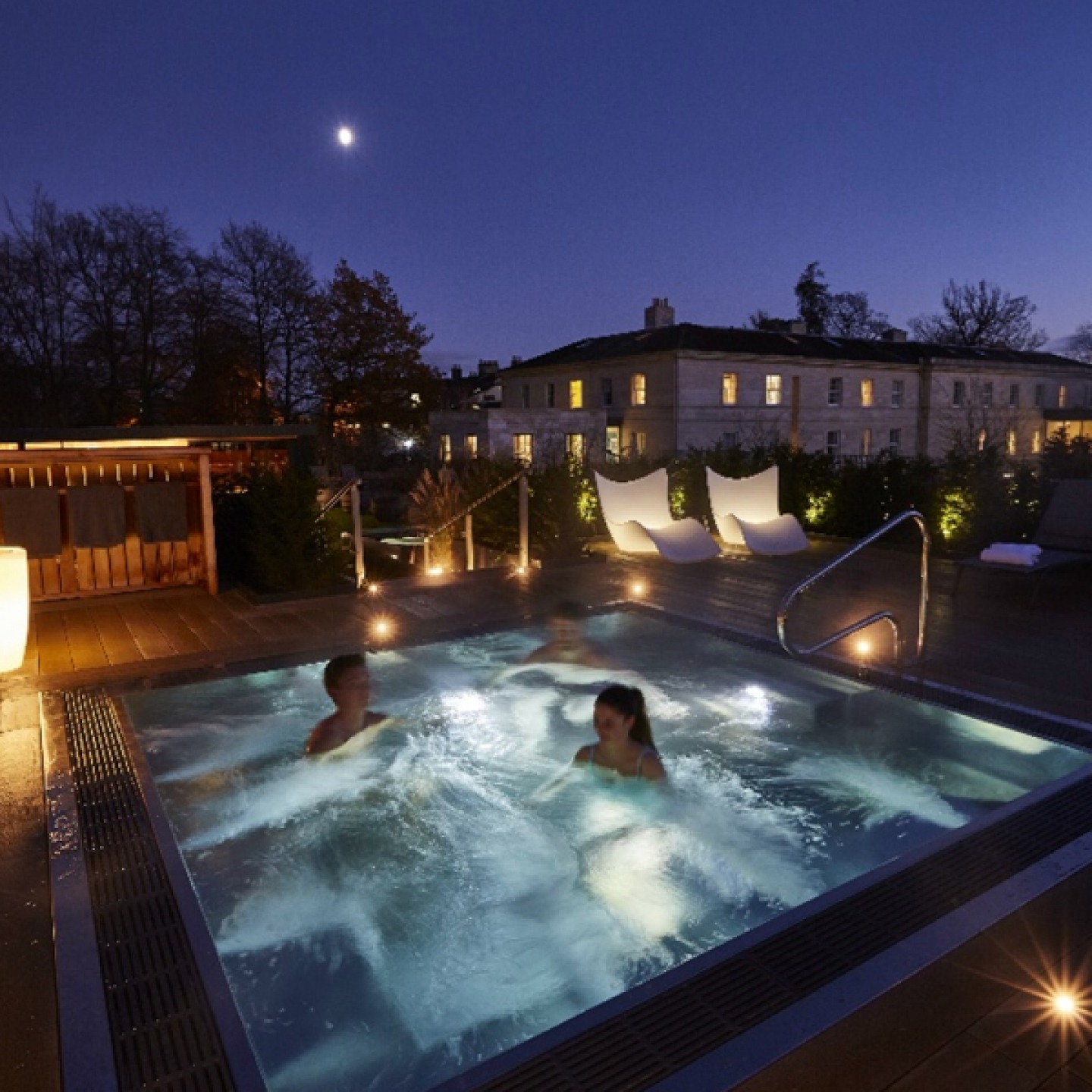 couple in hot tub in the dark