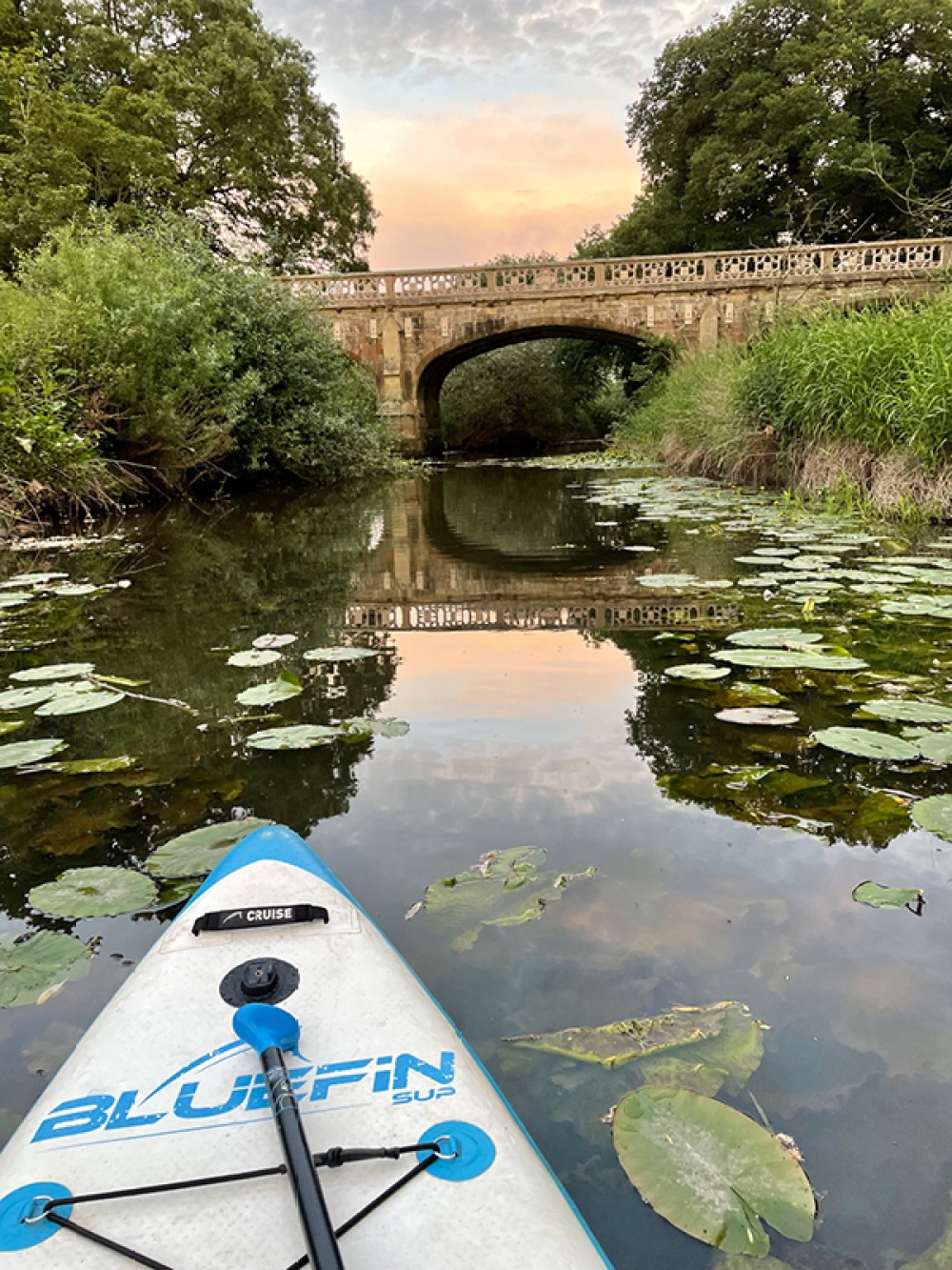 A peaceful paddle on the River Dee with a bridge in distance