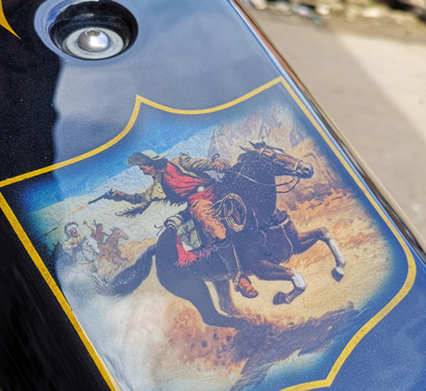 cowboy and Indians mural on a bike tank