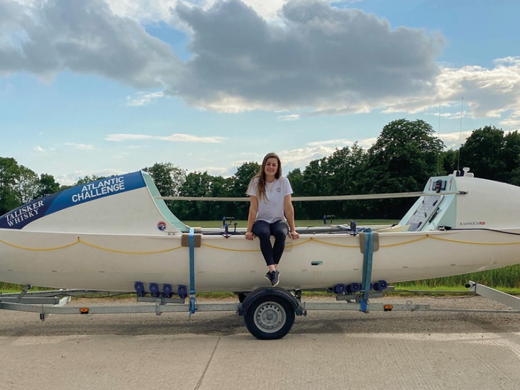 Miriam Payne sitting on her boat on land