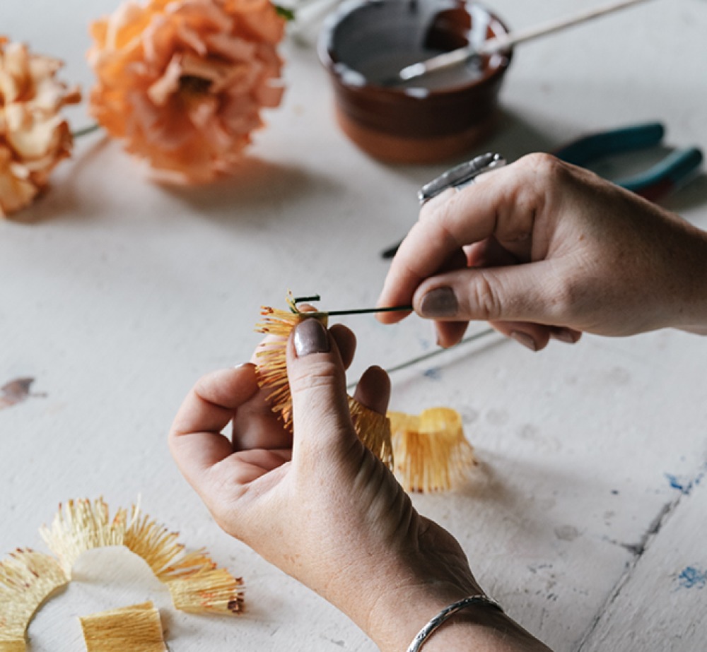 Sophie crafting paper flowers