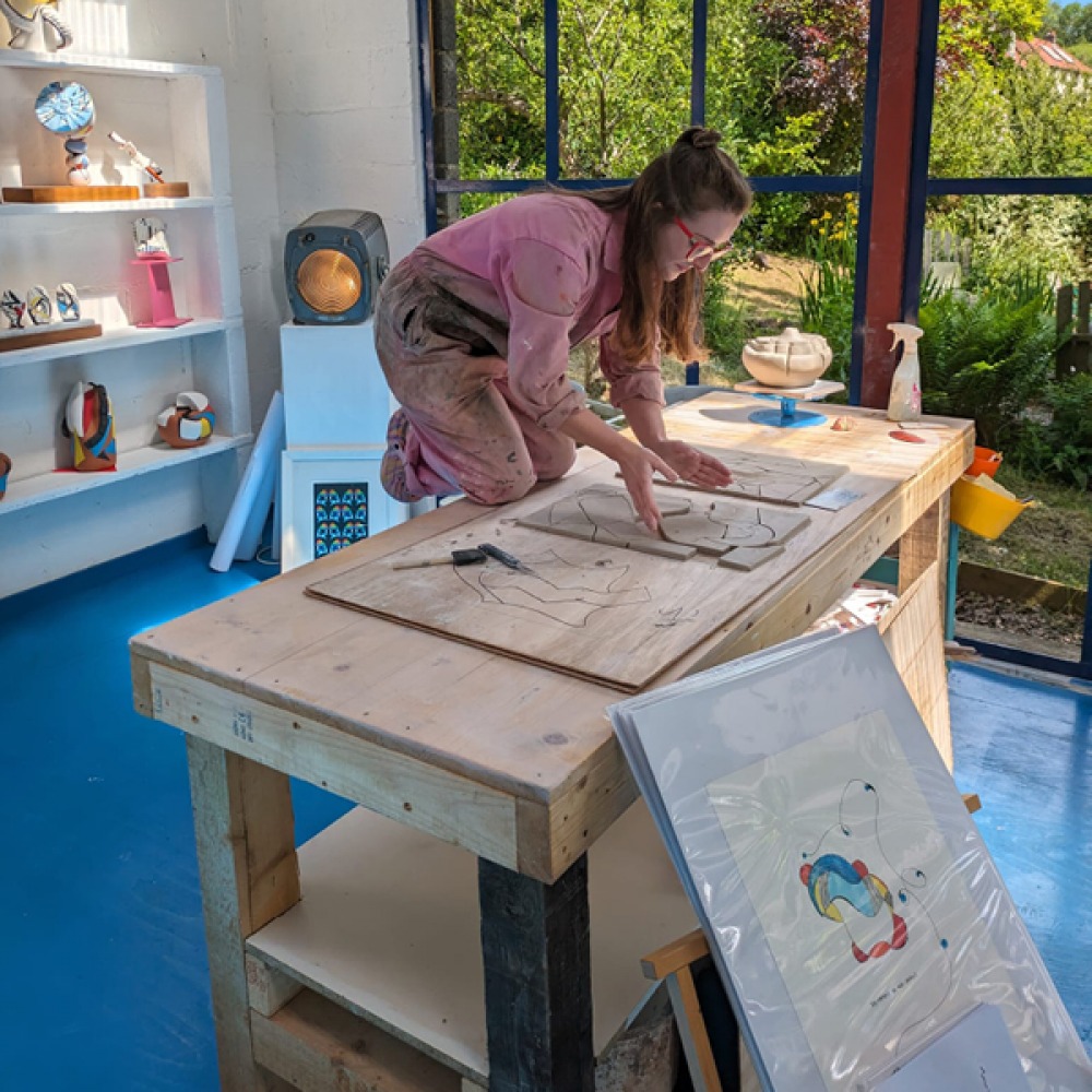 Aphra working in her studio