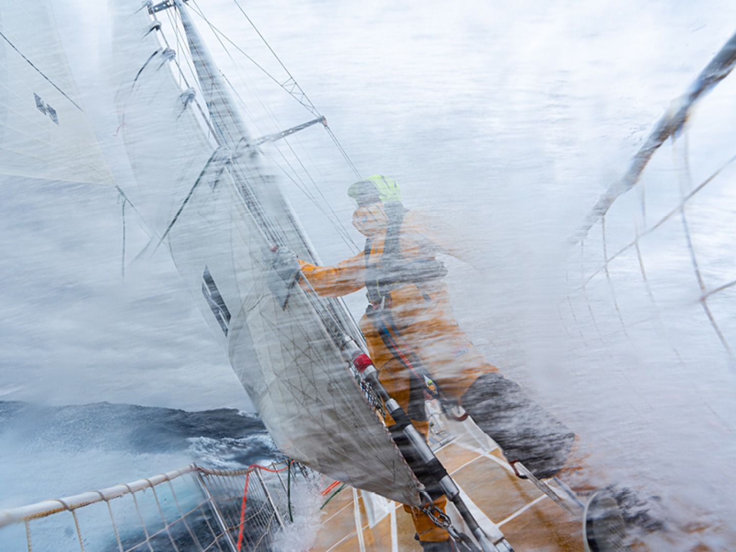 Sailors aboard yachts during Clipper race in high seas